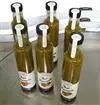 Etiquetadora para botellas y frascos con aplicación de sello de garantía